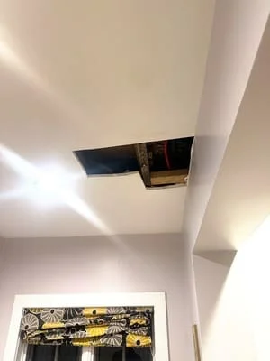 Recessed LED ceiling lights installed in white drywall ceiling with architectural soffit detail